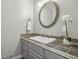 Charming bathroom featuring a stylish vanity, decorative mirror, and elegant tile countertop at 905 Brooksglen Dr, Roswell, GA 30075
