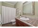 Bathroom with tile countertop, vanity and framed mirror at 905 Brooksglen Dr, Roswell, GA 30075