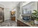 Elegant bathroom showcasing a vessel sink, decorative mirror, tile accents, and updated fixtures at 905 Brooksglen Dr, Roswell, GA 30075