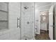 Contemporary shower featuring white tiling, a glass enclosure, and easy access to the bathroom at 905 Brooksglen Dr, Roswell, GA 30075