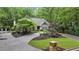Inviting home exterior with lush landscaping, a well-manicured lawn and a charming stone mailbox at 905 Brooksglen Dr, Roswell, GA 30075