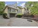 Charming home exterior with a two-car garage and a basketball hoop in the driveway at 905 Brooksglen Dr, Roswell, GA 30075