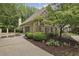 Beautiful home with stone and siding accents, professionally landscaped yard and a two-car garage at 905 Brooksglen Dr, Roswell, GA 30075