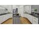 Well-lit kitchen with granite countertops, custom cabinetry, and stainless steel appliances at 905 Brooksglen Dr, Roswell, GA 30075