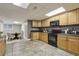 Basement kitchen with black appliances, dark countertops and light cabinets at 905 Brooksglen Dr, Roswell, GA 30075