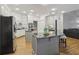Spacious kitchen with two islands, stainless steel appliances, and hardwood floors at 905 Brooksglen Dr, Roswell, GA 30075