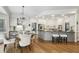 Open-concept kitchen with modern appliances, granite countertops, an island, and a breakfast nook at 905 Brooksglen Dr, Roswell, GA 30075