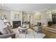 Inviting living room featuring a fireplace, hardwood floors, and neutral decor at 905 Brooksglen Dr, Roswell, GA 30075