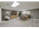 Finished basement office space with neutral decor and large built in shelves at 905 Brooksglen Dr, Roswell, GA 30075