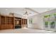 Spacious bonus room features wood bookshelves, ceiling fan, and outdoor access at 973 Peachtree Battle Ave, Atlanta, GA 30327