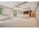 Large bonus room with ceiling fan, wood shelving, outdoor access, and neutral carpet at 973 Peachtree Battle Ave, Atlanta, GA 30327