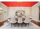 Formal dining room with a vibrant ceiling, elegant chandelier, and seating for eight at 973 Peachtree Battle Ave, Atlanta, GA 30327