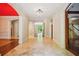 Grand foyer with marble floors, arched doorways, and views to the lushly landscaped backyard at 973 Peachtree Battle Ave, Atlanta, GA 30327