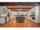 Spacious kitchen featuring a center island, stainless steel appliances, and custom cabinetry at 973 Peachtree Battle Ave, Atlanta, GA 30327