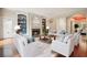 Elegant living room with a fireplace, built-in bookcases, and comfortable seating at 973 Peachtree Battle Ave, Atlanta, GA 30327