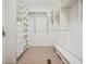 Spacious walk-in closet features custom shelving, drawers, and ample storage for organized convenience at 973 Peachtree Battle Ave, Atlanta, GA 30327