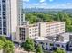 Bird's eye view capturing the condominium buildings and urban greenery with the city skyline at 1421 Peachtree Ne St # 304, Atlanta, GA 30309