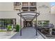 Inviting entrance to 1421 Peachtree Street Residential Condominiums with covered walkway and adjacent storefronts at 1421 Peachtree Ne St # 304, Atlanta, GA 30309