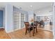 Dining area with mirrored wall and built-in bookcase next to the living room at 1421 Peachtree Ne St # 304, Atlanta, GA 30309