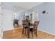 Dining area features hardwood floors, dining table, and mirrored wall for an expanded feel at 1421 Peachtree Ne St # 304, Atlanta, GA 30309