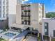Exterior view of the residential condominiums at 1421 Peachtree Street with a landscaped entrance at 1421 Peachtree Ne St # 304, Atlanta, GA 30309