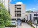 Exterior of the condominium complex at 1421 Peachtree Street, showcasing the entrance and landscaping at 1421 Peachtree Ne St # 304, Atlanta, GA 30309