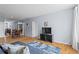 Bright living room with hardwood floors, a mirrored wall, and an adjacent dining area at 1421 Peachtree Ne St # 304, Atlanta, GA 30309