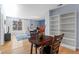 Inviting living room featuring a dining area, built-in bookcase, and a large window at 1421 Peachtree Ne St # 304, Atlanta, GA 30309