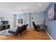 Bright living room features a comfortable futon, work desk, and natural light from a large window at 1421 Peachtree Ne St # 304, Atlanta, GA 30309