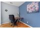 Office space with hardwood floors, blue accent wall, and painting at 1421 Peachtree Ne St # 304, Atlanta, GA 30309