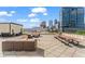 Relaxing rooftop deck with picnic tables and cozy seating, perfect for enjoying city vistas at 1421 Peachtree Ne St # 304, Atlanta, GA 30309