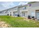 Townhome backyard with lawn and sliding glass door access to patio at 2255 Bigwood Trl, Atlanta, GA 30349