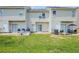 View of backyard with sliding glass doors leading to patio and lawn at 2255 Bigwood Trl, Atlanta, GA 30349