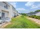 Backyard featuring a lawn and an outdoor space for relaxation and activities at 2255 Bigwood Trl, Atlanta, GA 30349
