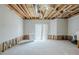Unfinished basement space with exposed ceiling, offering potential for customization at 2255 Bigwood Trl, Atlanta, GA 30349