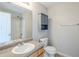 Bathroom featuring a single sink vanity with upper cabinet and a shower/tub combo at 2255 Bigwood Trl, Atlanta, GA 30349
