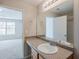 Bathroom with large mirror, spacious countertop and a view to another room at 2255 Bigwood Trl, Atlanta, GA 30349