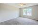Spacious bedroom featuring neutral walls, carpet and a ceiling fan at 2255 Bigwood Trl, Atlanta, GA 30349