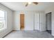 Bedroom featuring multiple doorways, neutral walls, and a ceiling fan at 2255 Bigwood Trl, Atlanta, GA 30349