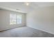 Bright, carpeted bedroom with vaulted ceiling and large window for natural light at 2255 Bigwood Trl, Atlanta, GA 30349