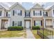 Charming townhouse featuring a well-manicured lawn and classic architectural details at 2255 Bigwood Trl, Atlanta, GA 30349