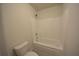 Bathroom featuring a white tub with shower at 2522 Bear Mountain St, Lithonia, GA 30058