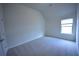 Cozy bedroom featuring neutral carpet and a window with natural light at 2522 Bear Mountain St, Lithonia, GA 30058