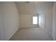 Bedroom featuring vaulted ceilings, carpeted floors, and a window at 2522 Bear Mountain St, Lithonia, GA 30058