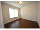 Cozy bedroom with hardwood floors, a bright window, and minimalist decor at 2522 Bear Mountain St, Lithonia, GA 30058