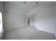 Bright bedroom featuring vaulted ceilings, carpeted floors, and a window at 2522 Bear Mountain St, Lithonia, GA 30058