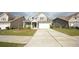 Charming two-story home featuring a gray exterior, a two-car garage, and a well-manicured lawn at 2522 Bear Mountain St, Lithonia, GA 30058