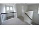 Second floor landing featuring carpet, white walls and access to multiple rooms at 2522 Bear Mountain St, Lithonia, GA 30058