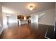 Open living area with hardwood floors that connect to the kitchen at 2522 Bear Mountain St, Lithonia, GA 30058