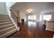 Spacious living room features hardwood floors, fireplace, and staircase access at 2522 Bear Mountain St, Lithonia, GA 30058